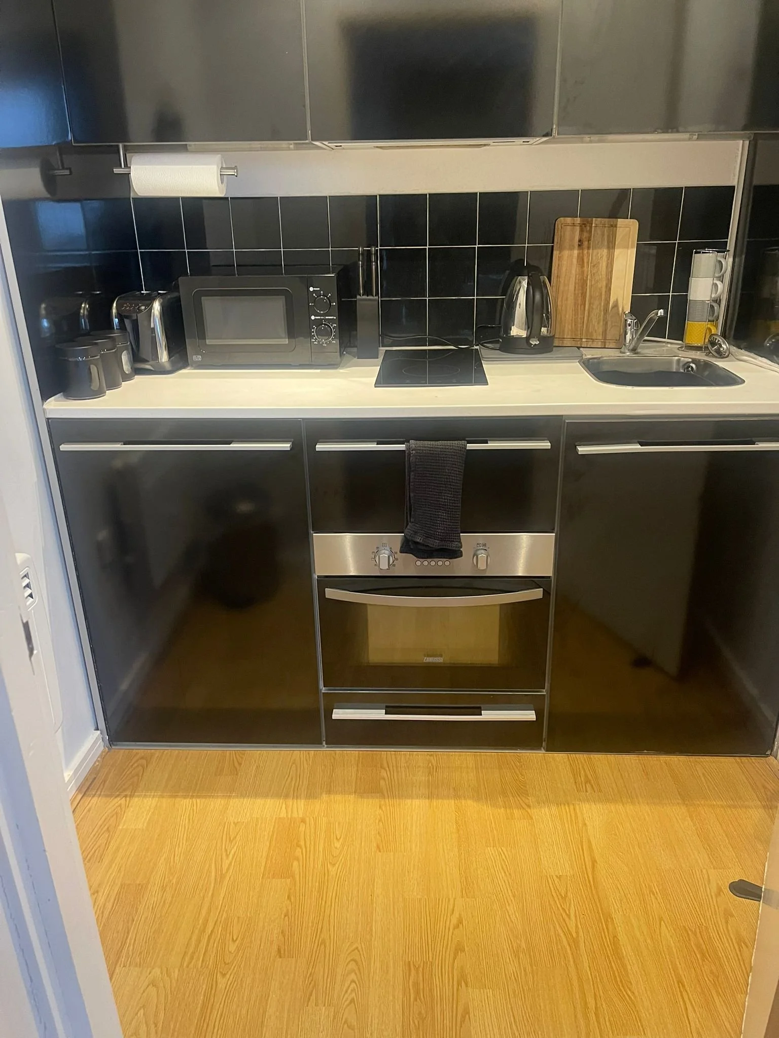 Clean, clear kitchen worktops and oven front after cleaning